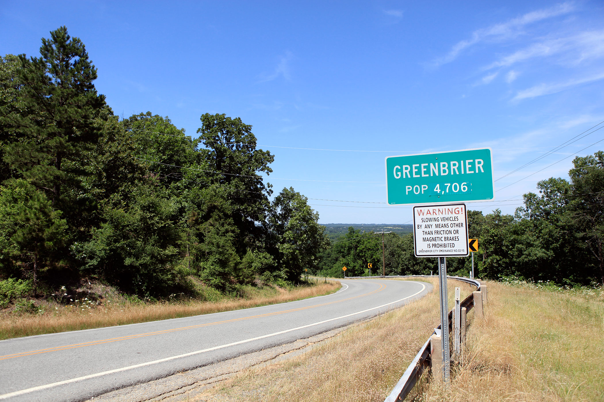 Greenbrier Arkansas City Limit Sign marked with a population of 4,706.